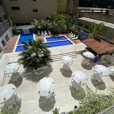 Flat em Pitangueiras - sacada gourmet, 3 dorms, limpeza diária e serv de praia Guarujá Exterior foto